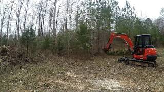 Clearing with mini excavator (Time Lapse)  (Kubota KX057)