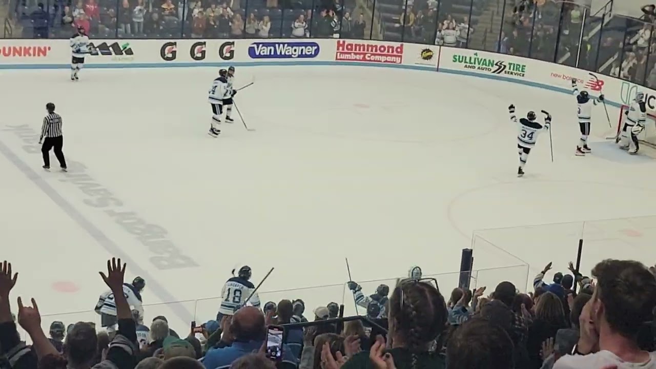 Maine men's hockey celebrates a win over #3 Quinnipiac in the home opener on Saturday, October 22