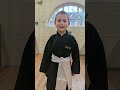 student after being awarded his first belt.