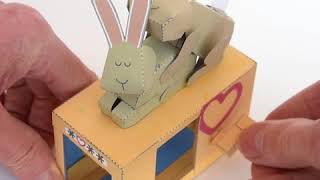 Love Bunnies - Paper Model
Love Bunnies:
Turn the handle on this delightful model and the rabbits do their stuff. Driven by a two-lobed cam for a fast action, this salacious model is certain to quicken the heartbeat.
The download is a series of four pages printed front and back ready for you to print out and assemble. Also included are fully illustrated instructions for construction.
More information at http://www.cardbawdy.net Love Bunnies - Paper Model