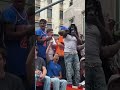 Knicks fans climbed on top of DSNY trucks