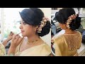 Christian bride with floral hairstyle and silk saree