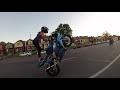 A young lady does an amazing motorcycle stunts