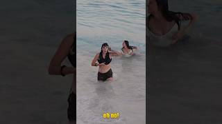 Dakota gets hit by a big wave a loses her top! #wave #surf #bahamas #sailing