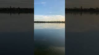 The Suns Reflection Creates A Shimmering Path Of Light On The Waters Surface