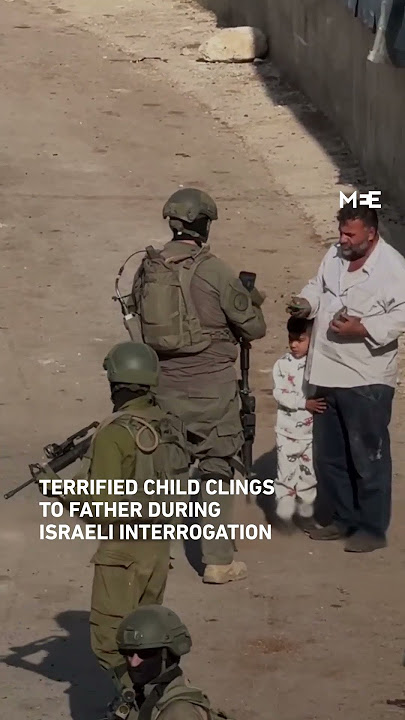 Palestinian child clings to father in fear of Israeli soldiers