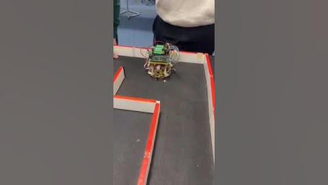 Testing our unfinished micro mouse in a maze- sensor not yet working perfectly.