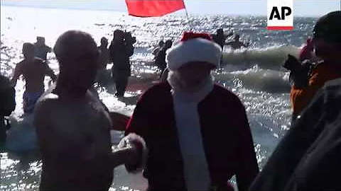 New Yorkers take to the water for the annual "Polar Plunge" at Coney Island to celebrate New Year's