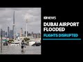 Dubai airport floods disrupt hundreds of international flights as thunderstorms lash UAE | ABC News