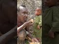 African tribal dad cools food for his child with love 🍽️❤️#FatherLove #TribalLife#Africa #FamilyCare