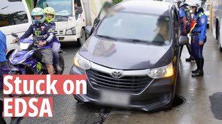 Car falls into manhole - EDSA