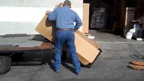 Susan loading a Liberty gun safe on a trailer