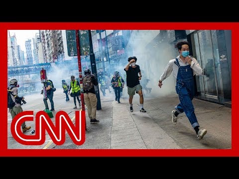 Police fire tear gas at protesters as unrest returns to streets of Hong Kong