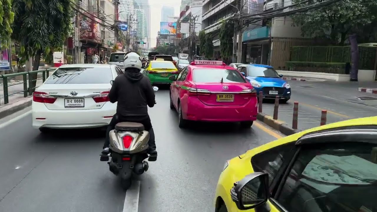 Motorbike ride in typical Bangkok's traffic