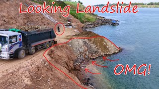 Trucks Are Unloading 25Ton Stone Soils Into Deep Water To Stop Landslide Down Bulldozer Komatsu D31A