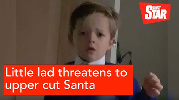 Little lad threatens to upper cut Santa