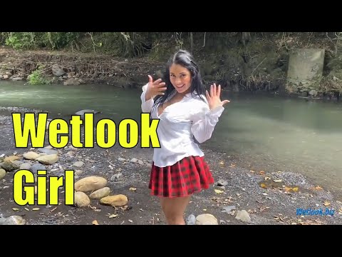 Wetlook girl in mountain river in skirt and a white shirt get wet | Wetlook girl bathing dressed