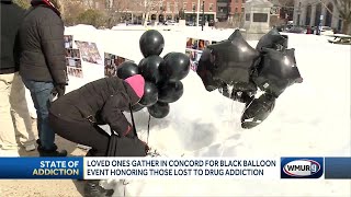 Black balloons carried at vigil in memory of overdose victims