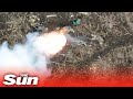 Russian soldiers catch fire as Ukrainian drones drop bombs on foxholes