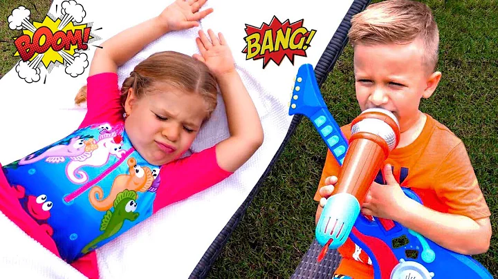 Diana is sleeping. Her brother Roma plays with lou...