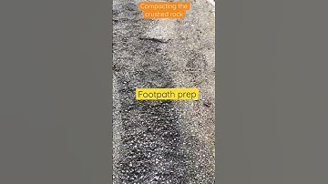 Compacting crushed rock for new footpath