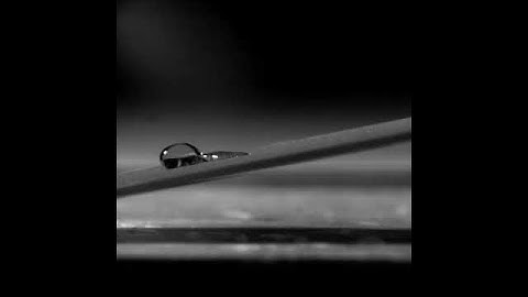 Water droplet rolling through a pinned droplet