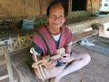 Joueur de guitare 3 cordes du Laos