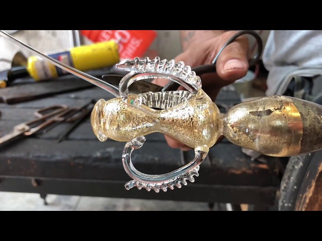 Glass artist Manolo Aguilera creates a traditional Venetian goblet with gold leaf