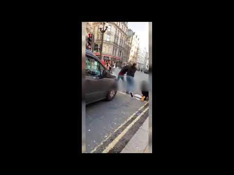 Shocking video shows men brawling in front of cars on busy London street