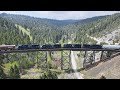 Full throttle heavy trains  helper engines on montana rail links mullan pass
