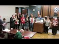 Cox leads courthouse carolers