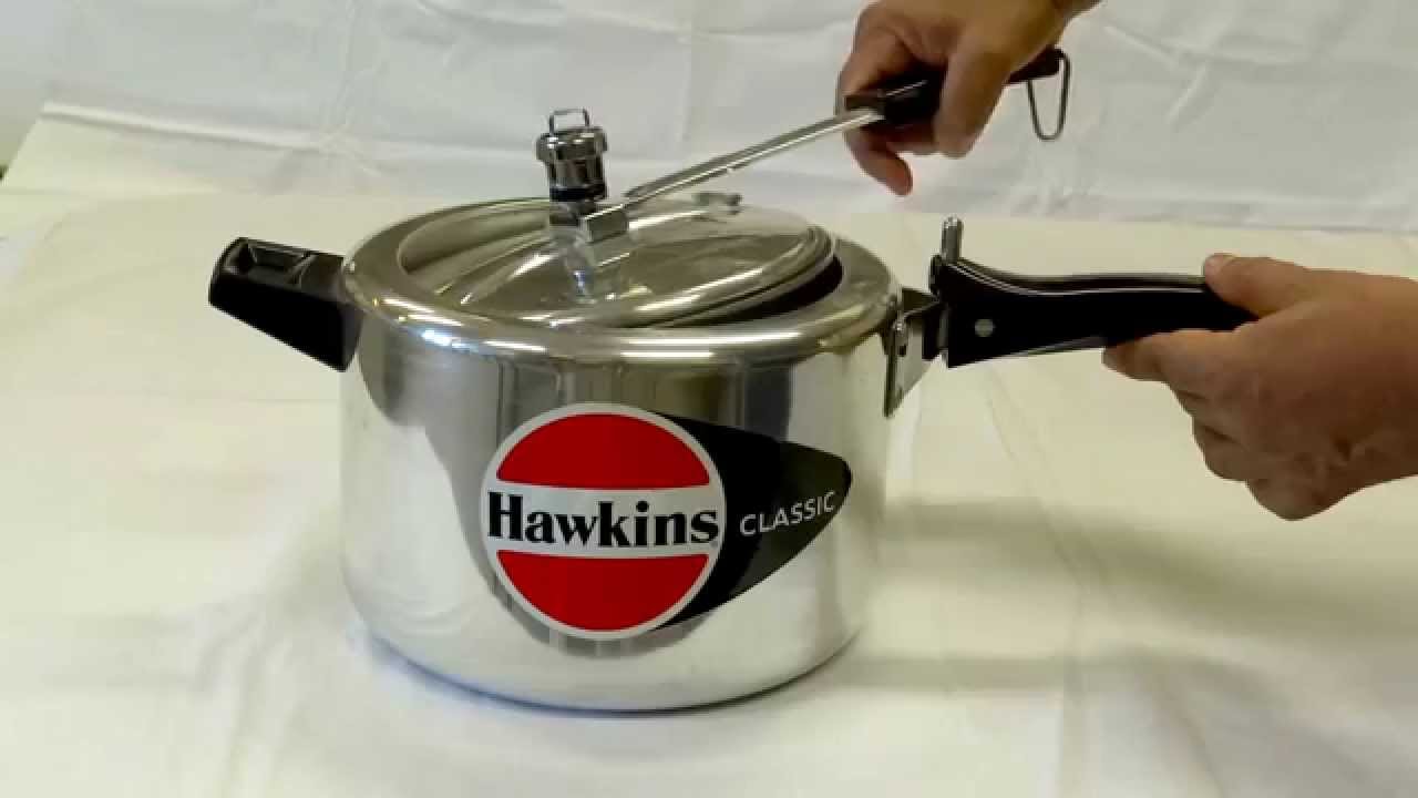 How to Open and Close the Lid of your Zavor Pressure Cooker  To open the  lid, pull back on the lock on the top handle and turn the lid  counterclockwise until