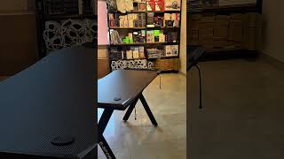🎮 Upgrade Your Gaming Setup!Premium Gaming Desk featuring a sleek carbon fiber surface.