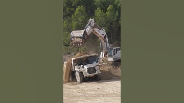 Semak Liebherr 984 loading Terex TR60 trucks on a new commercial development close to Barcelona.