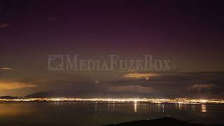Stock Video - Timelapse of sunset over Utah Lake fading into night with the Aurora
