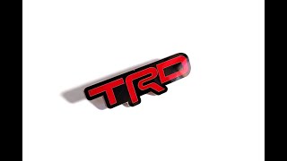 Car grill emblem with logo TRD