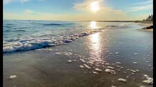 Gentle Waves Roll onto Hardings Beach on Sunny Day at Chatham, Cape Cod : Stock Footage #211d