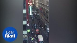 Chaos on NYC street after man attacks cops with meat cleaver - Daily Mail