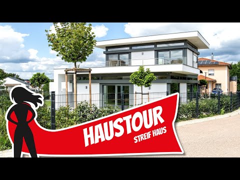 Video: Modern-Industrial Lakeside Haus für eine Familie von acht