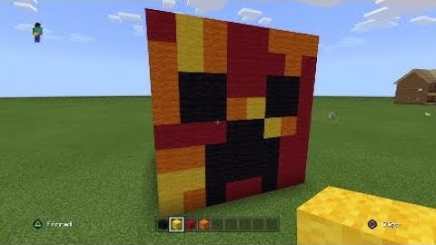 Minecraft how to build a red creeper head statue