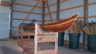 Photos showing several steps in the construction of a wood strip Kayak.