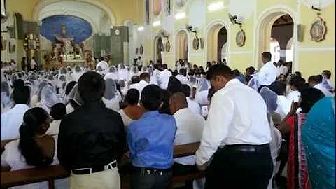 Ryan Abeyesundere receiving First Holy Communion