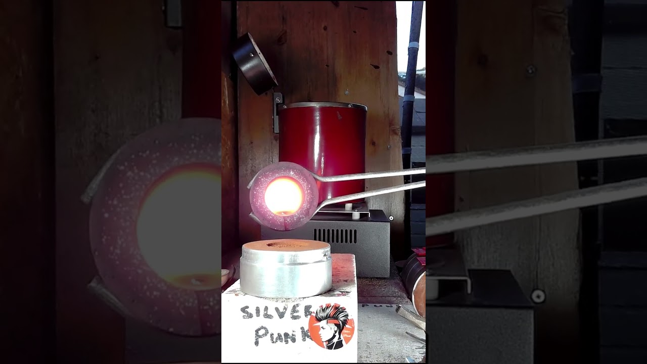 Hand pouring MOLTEN silver into sand, making a coin round!