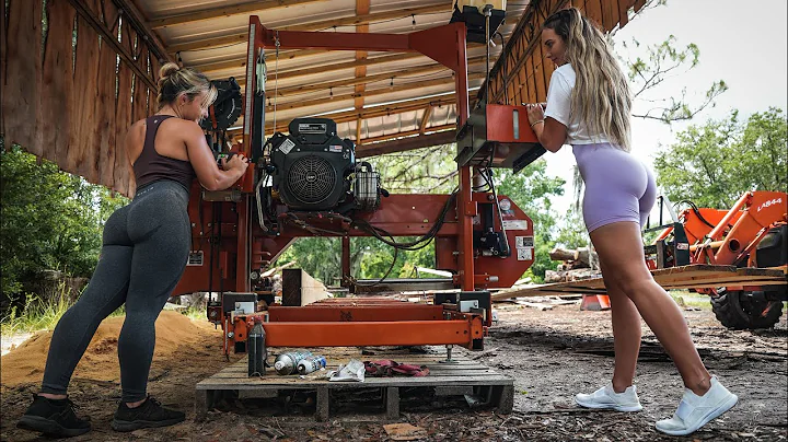 Two Beautiful Blondes Cutting Dimensional Lumber O...