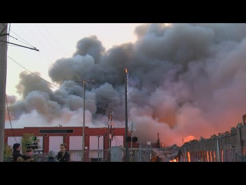 Warehouse fire still burning after 24 hours