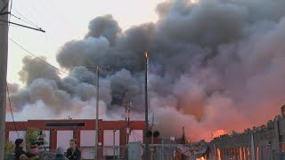 Warehouse fire still burning after 24 hours
