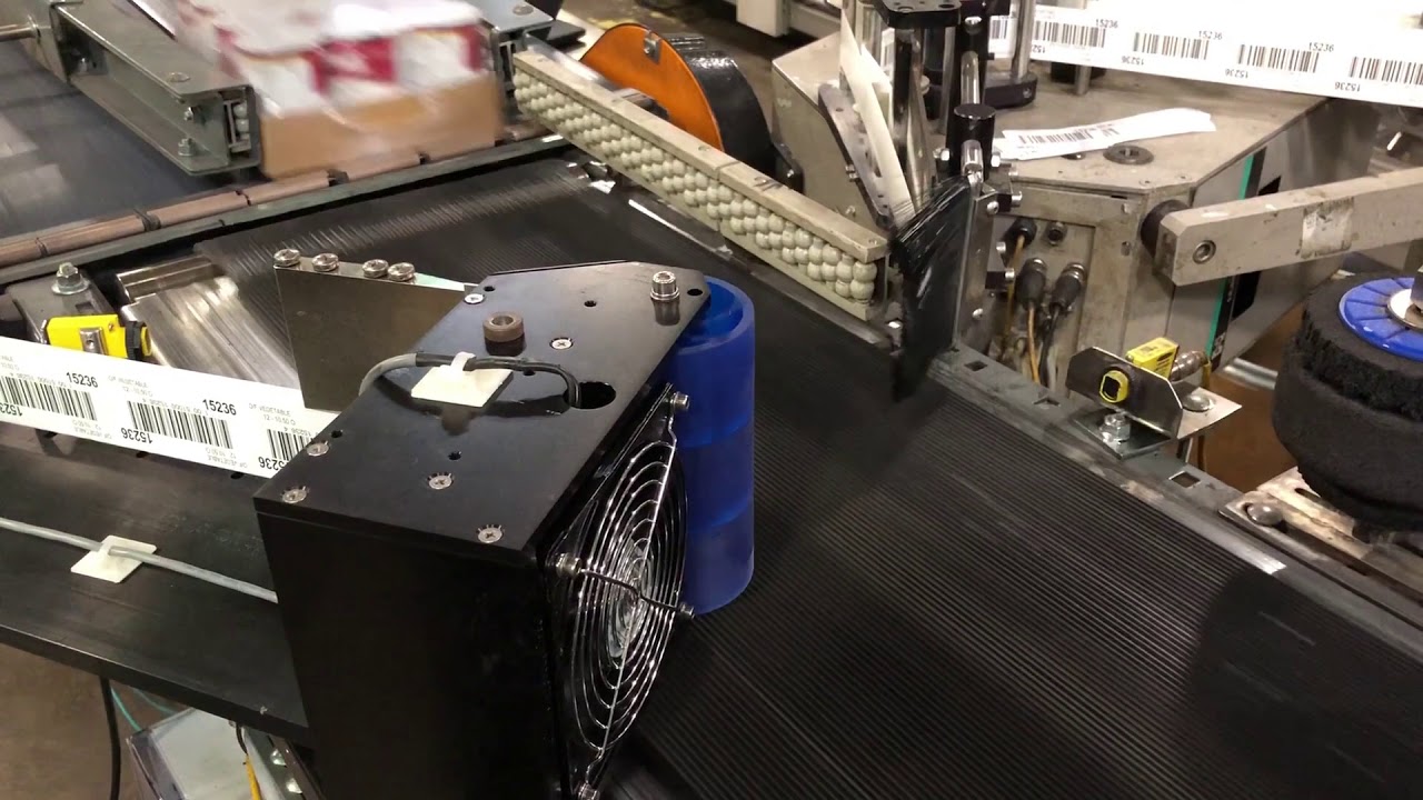 Model ST1000 Label Applicator Applying Labels to the Side of Cases