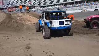 Jeeps take on the obstacle course at the Jeep Beach 'Main Event' at Daytona Speedway