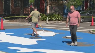 Koi fish street art project transforms Marigny intersection