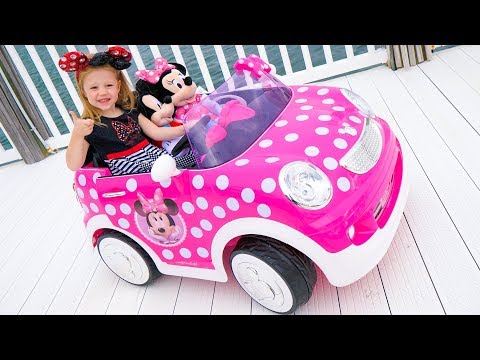 Stacy and the new children's car ride on with a minnie mouse